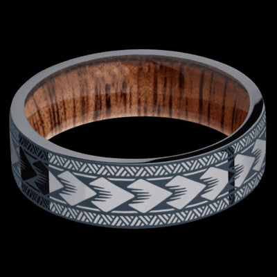 7 mm wide/Flat/Tantalum band with a laser carved Maori pattern also featuring a Koa sleeve.